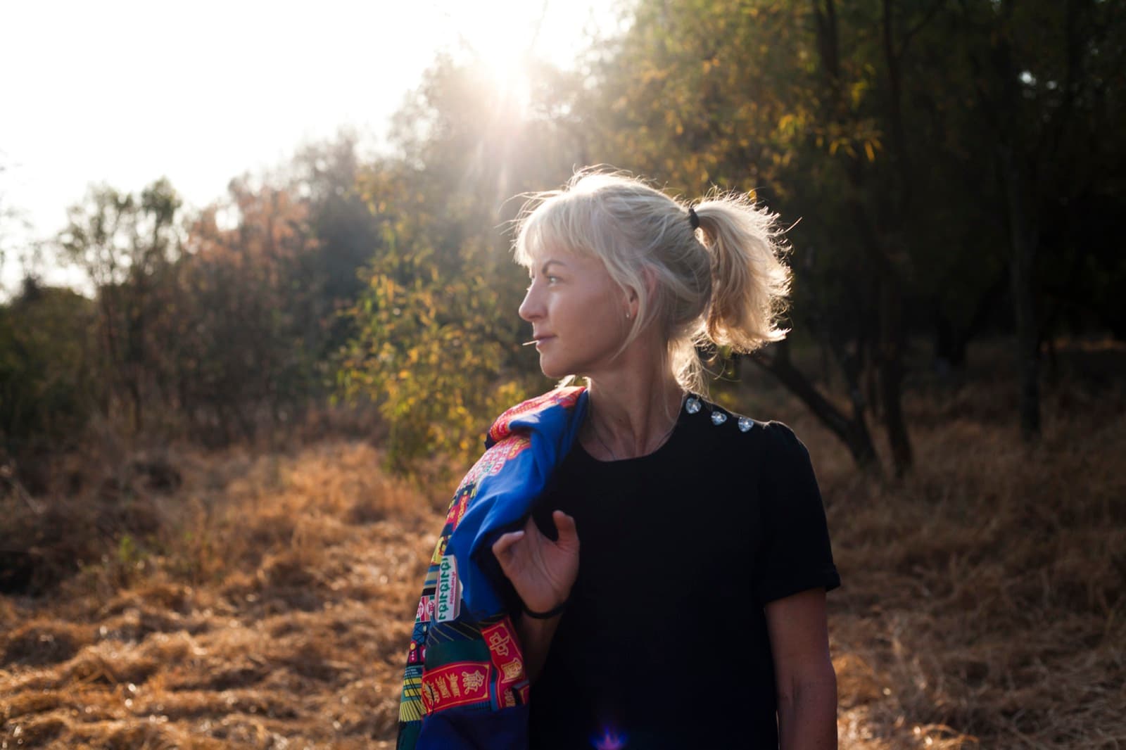 Client walking outdoors at golden hour after a wellness session